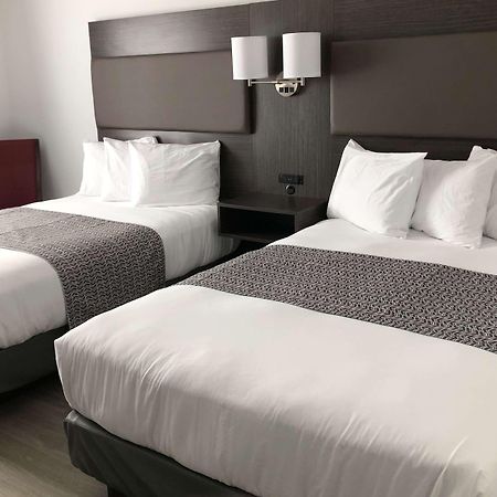 แทรเวลลอดจ์ บาย วินด์แฮม ริโก Hotel Rigaud ภายนอก รูปภาพ